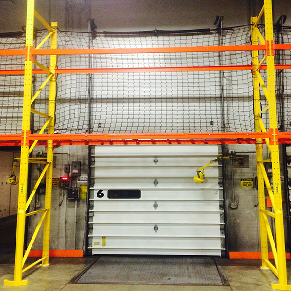Pallet Racking with safety netting for Over-Dock Door in Warehouse.
